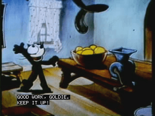 Frame from an old-timey cartoon with closed captioning "Good work, Goldie. Keep it up!"