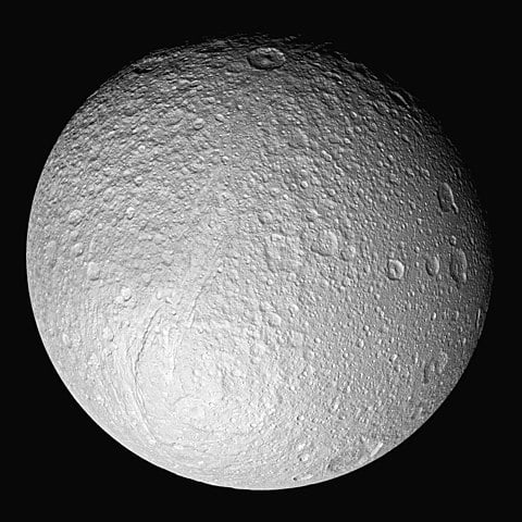 Saturn's fifth-largest moon, Tethys, is lit primarily by the sun, with some light reflected from Saturn. This is diffuse lighting.